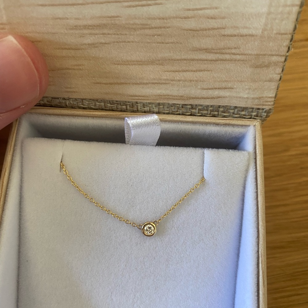 14k solid gold diamond bezel necklace. Diamond is .07 tcw, 16-18 in chain.